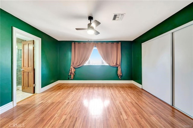 5306 W W Ave M4, Lancaster, CA 93536 - unfurnished room with ceiling fan, wood finished floors, and baseboards