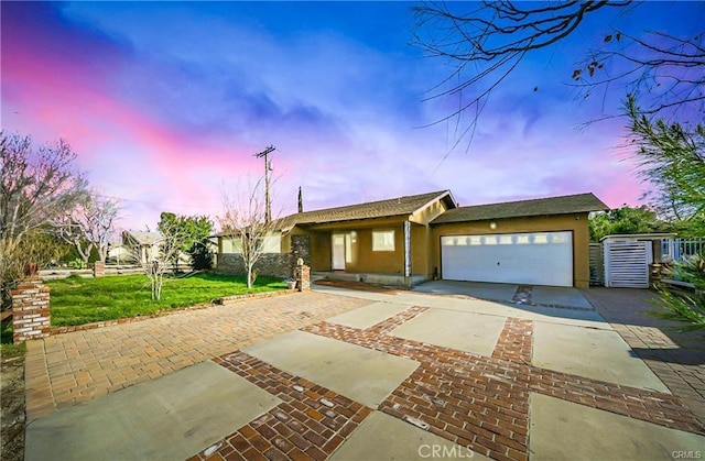 5306 W W Ave M4, Lancaster, CA 93536 - ranch-style house featuring concrete driveway, a yard, a garage, and stucco siding