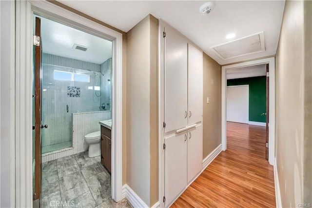 5306 W W Ave M4, Lancaster, CA 93536 - corridor with attic access and light wood-style flooring