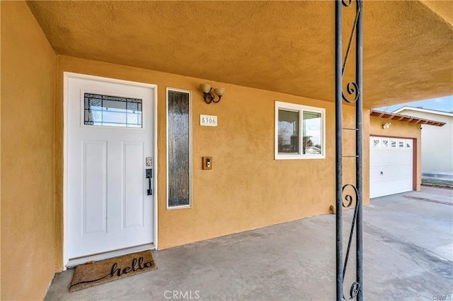 5306 W W Ave M4, Lancaster, CA 93536 - property entrance with stucco siding and a garage