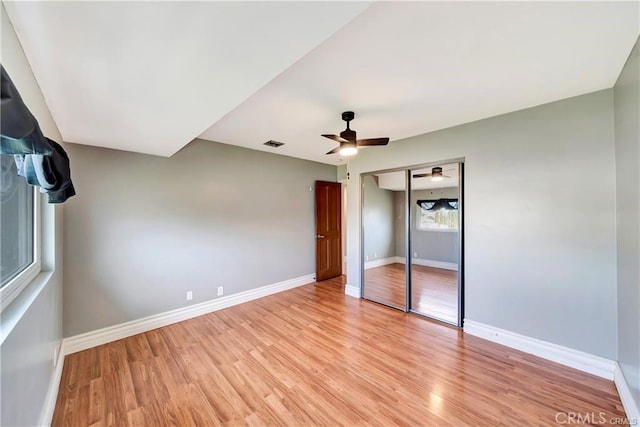 5306 W W Ave M4, Lancaster, CA 93536 - unfurnished bedroom featuring light wood-style floors, baseboards, and a closet