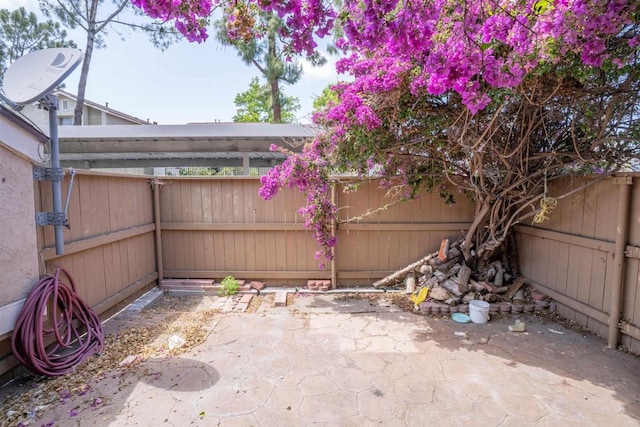 6860 Panamint Row Unit 2, San Diego, CA 92139 - view of patio with a fenced backyard