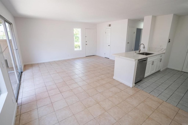 6860 Panamint Row Unit 2, San Diego, CA 92139 - kitchen featuring a sink, stainless steel dishwasher, healthy amount of natural light, and light tile patterned floors