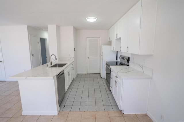 6860 Panamint Row Unit 2, San Diego, CA 92139 - kitchen with stainless steel appliances, a sink, a peninsula, and light tile patterned floors