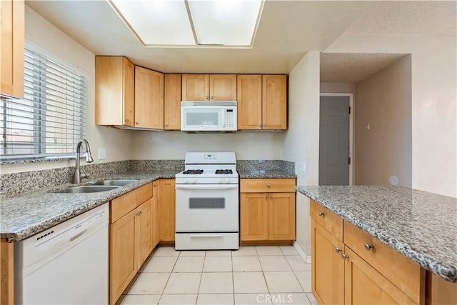 14889 Hartford Ln, Helendale, CA 92342 - kitchen with white appliances, a sink, light stone countertops, and light tile patterned floors