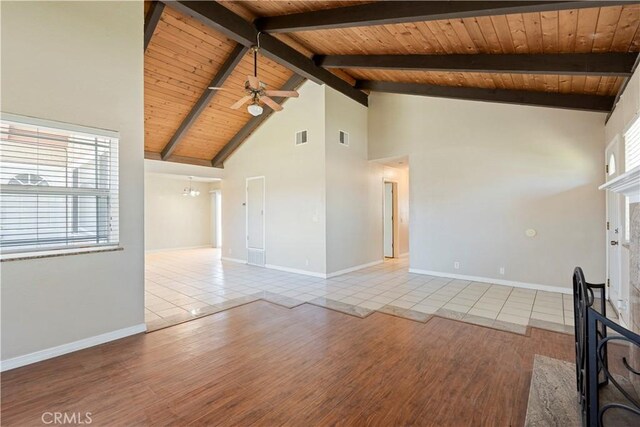 14889 Hartford Ln, Helendale, CA 92342 - unfurnished living room featuring wood ceiling, ceiling fan, tile patterned floors, high vaulted ceiling, and baseboards
