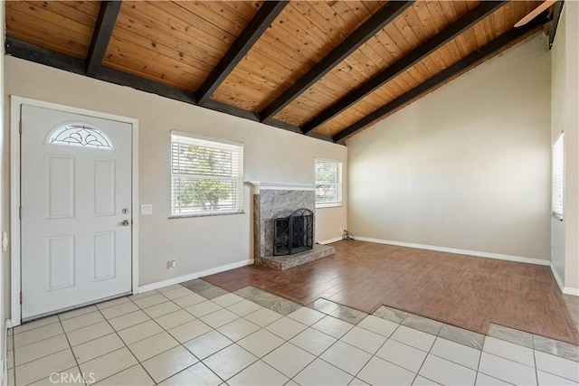 14889 Hartford Ln, Helendale, CA 92342 - foyer entrance featuring wood ceiling, a fireplace with raised hearth, light wood-style floors, and baseboards