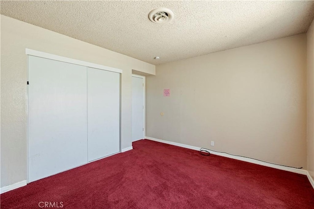 14889 Hartford Ln, Helendale, CA 92342 - unfurnished bedroom featuring carpet flooring, a closet, a textured ceiling, and baseboards
