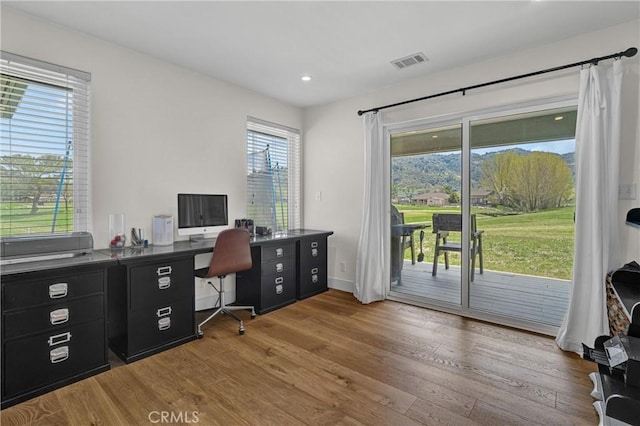 office area featuring wood finished floors, recessed lighting, and baseboards