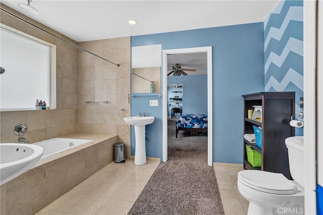 bathroom with toilet, a relaxing tiled tub, a ceiling fan, a tile shower, and tile patterned flooring