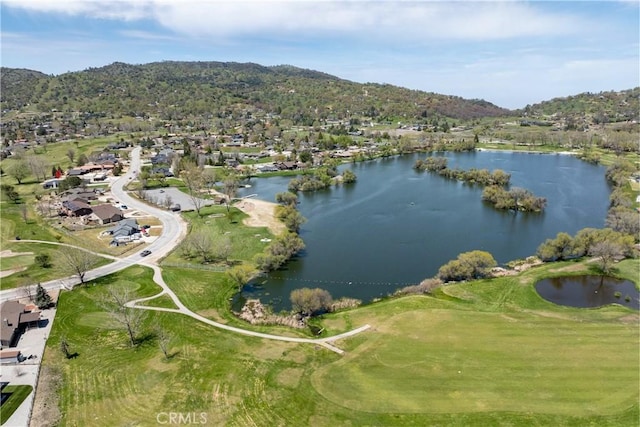 aerial view of property's location with a water and mountain view, nearby suburban area, and a golf club