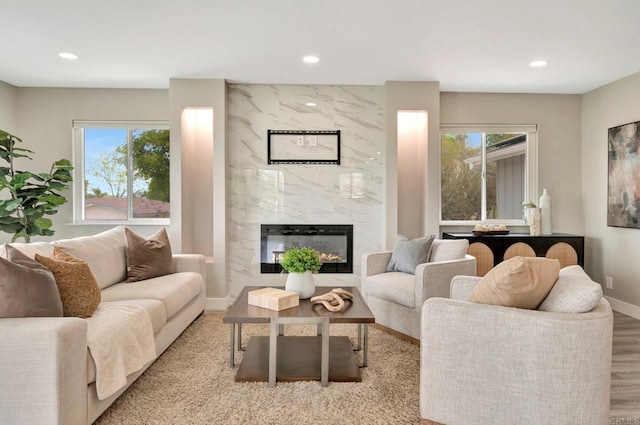 1055 Via Lomita, Escondido, CA 92027 - living area with healthy amount of natural light, recessed lighting, baseboards, a high end fireplace, and wood finished floors