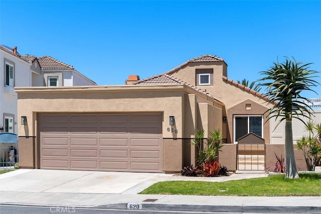 620 Via Umbroso, San Clemente, CA 92672 - mediterranean / spanish-style home featuring stucco siding, an attached garage, a tile roof, and driveway