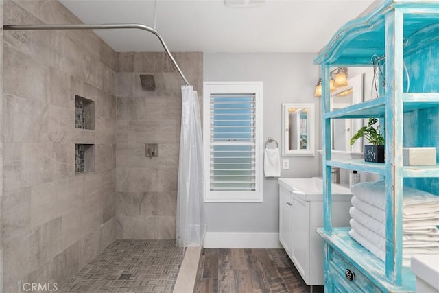 620 Via Umbroso, San Clemente, CA 92672 - full bathroom featuring tiled shower, vanity, wood finished floors, and baseboards