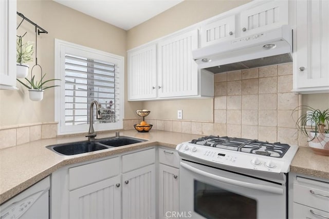 620 Via Umbroso, San Clemente, CA 92672 - kitchen with white appliances, a sink, under cabinet range hood, white cabinets, and backsplash