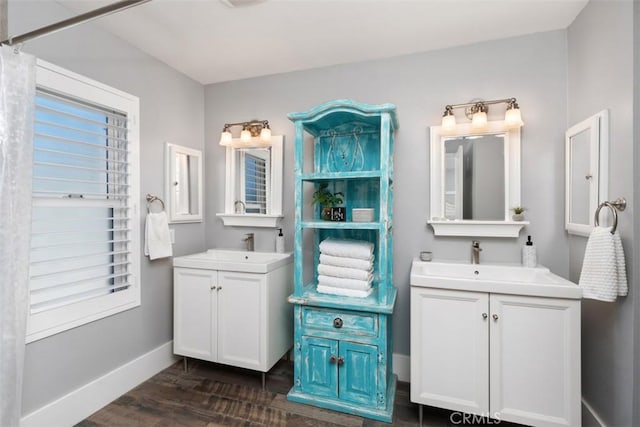 620 Via Umbroso, San Clemente, CA 92672 - full bath featuring baseboards, two vanities, and wood finished floors