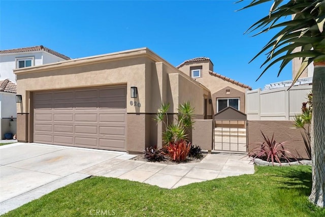 620 Via Umbroso, San Clemente, CA 92672 - mediterranean / spanish-style home with stucco siding, a tile roof, an attached garage, and driveway