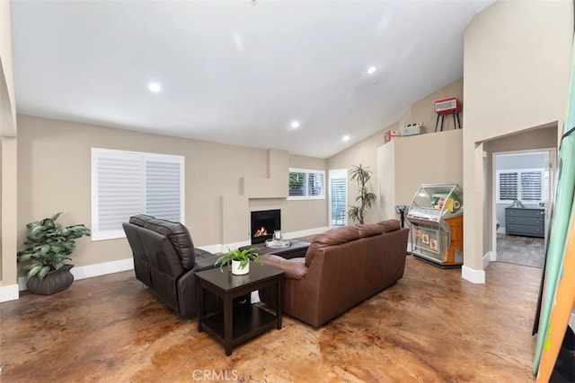 620 Via Umbroso, San Clemente, CA 92672 - living area with baseboards, concrete floors, a lit fireplace, recessed lighting, and vaulted ceiling