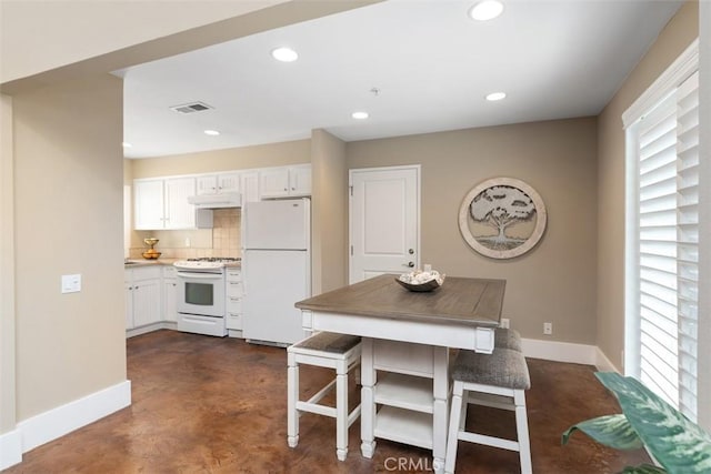 620 Via Umbroso, San Clemente, CA 92672 - kitchen featuring white appliances, baseboards, concrete flooring, healthy amount of natural light, and recessed lighting