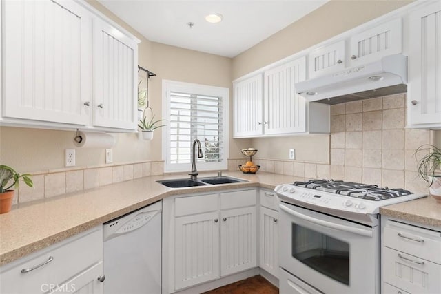 620 Via Umbroso, San Clemente, CA 92672 - kitchen with white appliances, a sink, under cabinet range hood, backsplash, and white cabinets