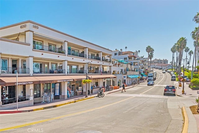 620 Via Umbroso, San Clemente, CA 92672 - view of asphalt street with street lighting, curbs, sidewalks, and a residential view