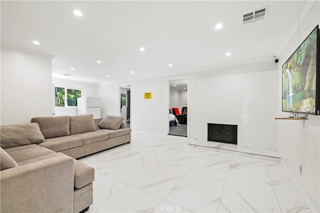 living area with recessed lighting, a fireplace with raised hearth, baseboards, and marble finish flooring
