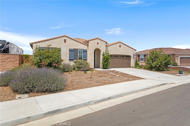 27083 Comrade Cir, Menifee, CA 92585 - mediterranean / spanish-style home featuring a garage, stucco siding, concrete driveway, and a tile roof