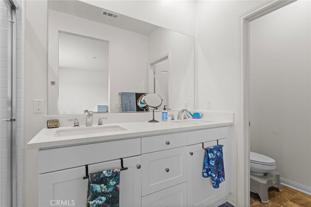27083 Comrade Cir, Menifee, CA 92585 - full bathroom with toilet, double vanity, and an enclosed shower
