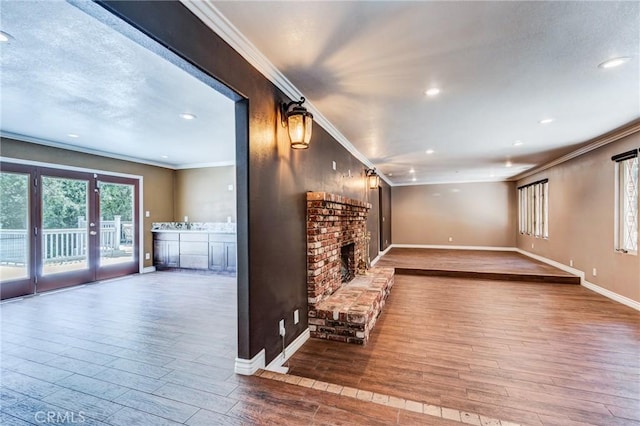 37095 Oak View Rd, Yucaipa, CA 92399 - unfurnished living room featuring ornamental molding, wood finished floors, baseboards, recessed lighting, and a fireplace