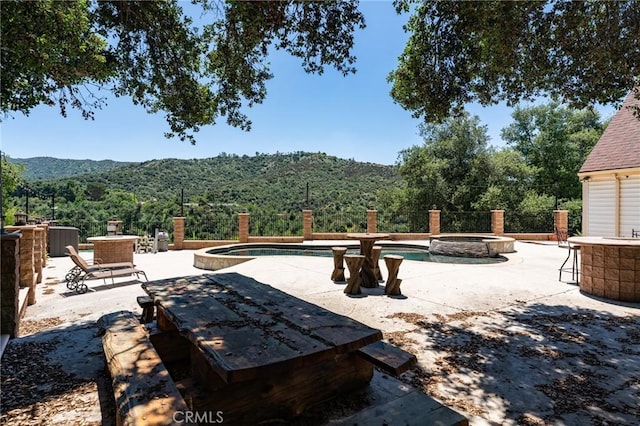 37095 Oak View Rd, Yucaipa, CA 92399 - view of patio with a mountain view and a pool with connected hot tub