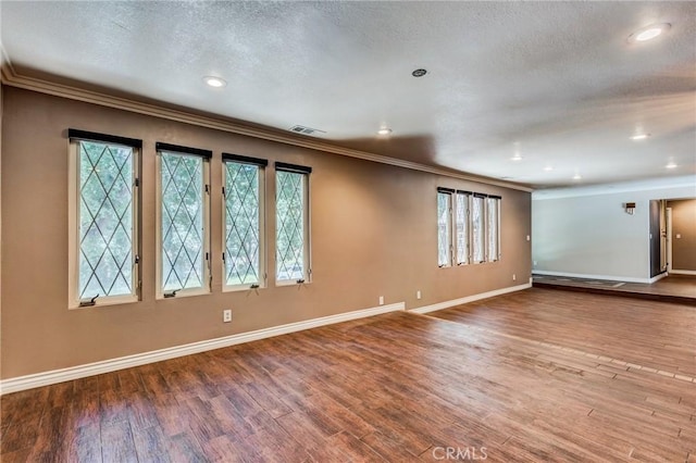 37095 Oak View Rd, Yucaipa, CA 92399 - unfurnished room with ornamental molding, healthy amount of natural light, baseboards, wood finished floors, and a textured ceiling