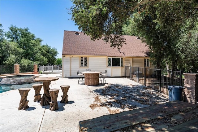 37095 Oak View Rd, Yucaipa, CA 92399 - back of property with outdoor dining area, a shingled roof, a patio, central air condition unit, and a pool with connected hot tub