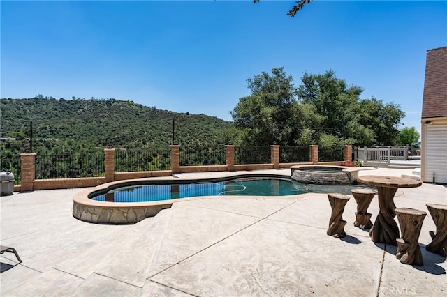37095 Oak View Rd, Yucaipa, CA 92399 - view of pool with a patio, a mountain view, and a pool with connected hot tub