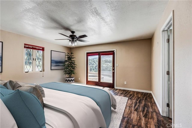 37095 Oak View Rd, Yucaipa, CA 92399 - bedroom with dark wood-style floors, access to outside, multiple windows, a textured ceiling, and baseboards