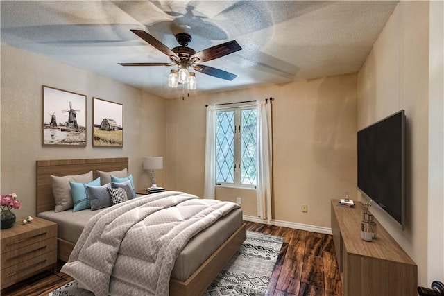 37095 Oak View Rd, Yucaipa, CA 92399 - bedroom featuring dark wood-style flooring, baseboards, a textured ceiling, and a ceiling fan
