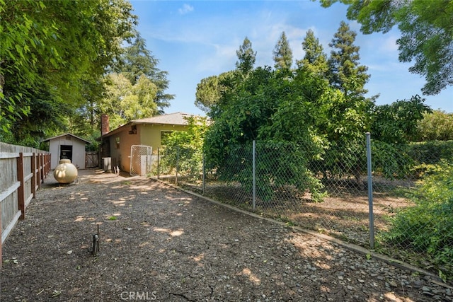 5375 Nord Hwy, Chico, CA 95973 - view of yard with fence, an outdoor structure, and a storage unit
