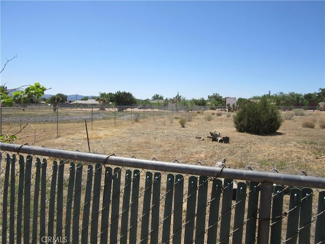 14951 Cactus St, Hesperia, CA 92345 - view of yard featuring a rural view and fence