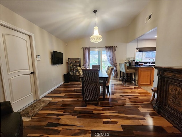 1428 Blenbury Dr, Diamond Bar, CA 91765 - dining room featuring dark wood-style flooring, plenty of natural light, lofted ceiling, and baseboards