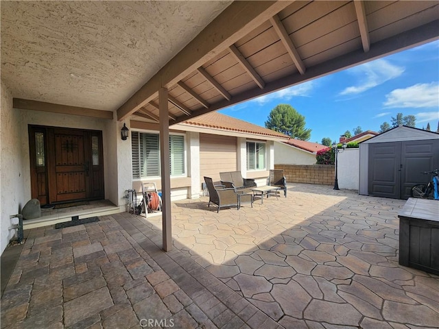 1428 Blenbury Dr, Diamond Bar, CA 91765 - view of patio / terrace featuring a storage unit, an outdoor structure, and fence