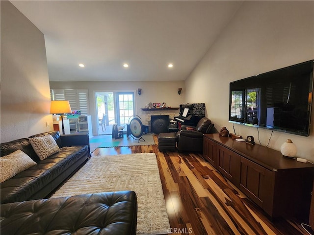 1428 Blenbury Dr, Diamond Bar, CA 91765 - living room featuring a stone fireplace, wood finished floors, recessed lighting, and vaulted ceiling