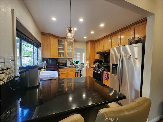 1428 Blenbury Dr, Diamond Bar, CA 91765 - kitchen with stainless steel appliances, recessed lighting, a kitchen bar, under cabinet range hood, and dark countertops