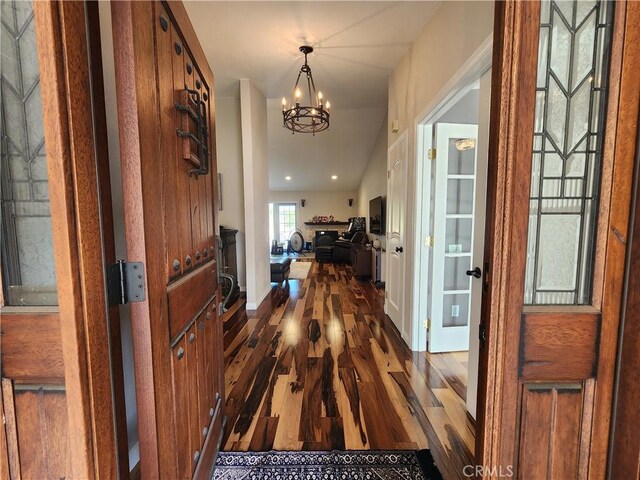 1428 Blenbury Dr, Diamond Bar, CA 91765 - entrance foyer with dark wood-style flooring, a chandelier, and baseboards