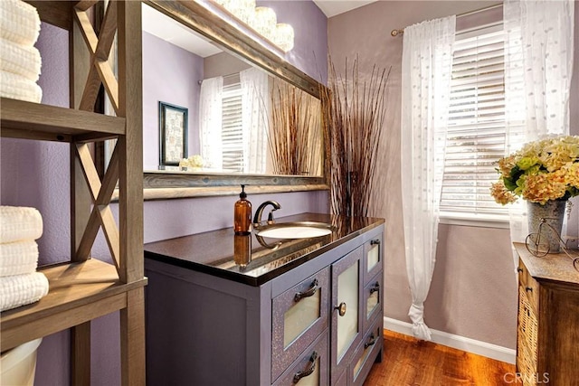 678 Buckingham Sq, Lake Arrowhead, CA 92352 - bathroom with wood finished floors, vanity, and baseboards