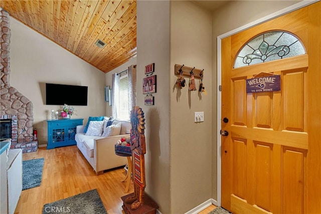 678 Buckingham Sq, Lake Arrowhead, CA 92352 - foyer entrance with wood ceiling, light wood-style flooring, a stone fireplace, baseboards, and high vaulted ceiling