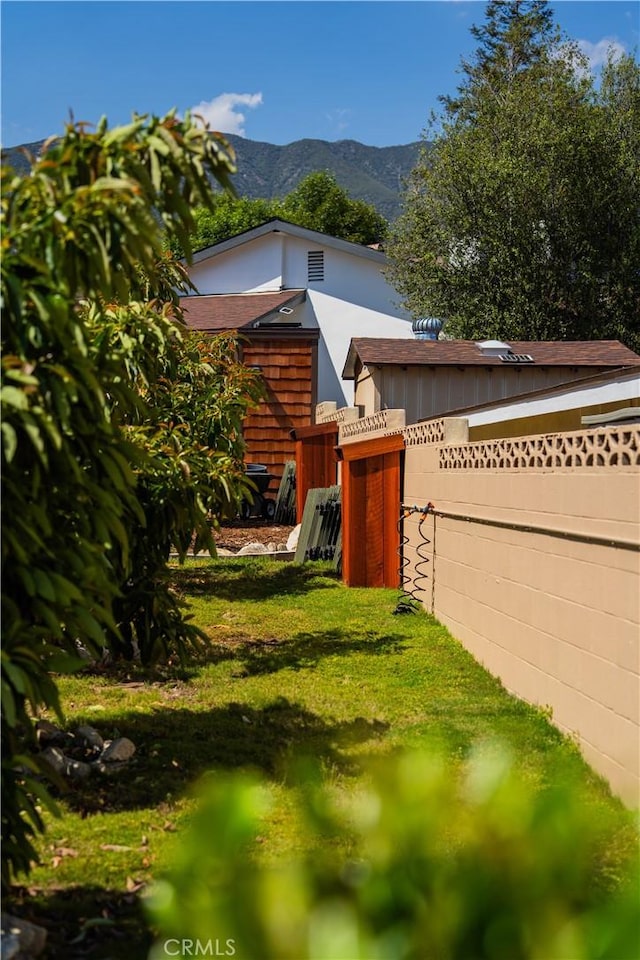 895 W 23rd St, Upland, CA 91784 - view of front of home with a mountain view and fence