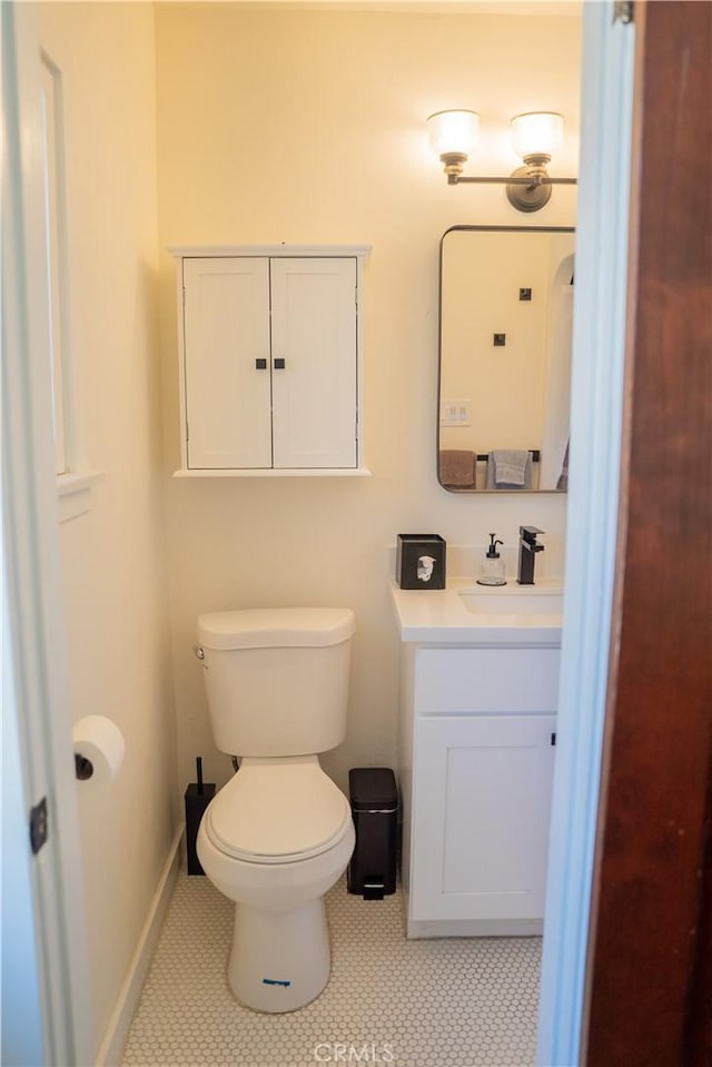 895 W 23rd St, Upland, CA 91784 - bathroom with vanity, toilet, tile patterned floors, and baseboards