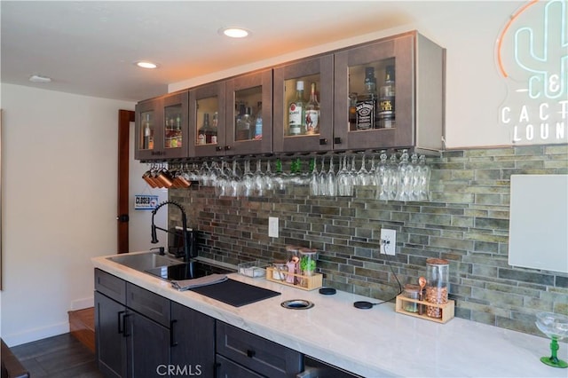 895 W 23rd St, Upland, CA 91784 - bar featuring a sink, tasteful backsplash, recessed lighting, dark wood-style floors, and baseboards
