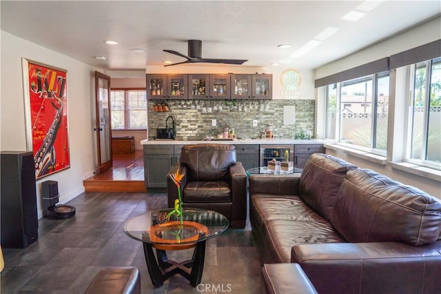 895 W 23rd St, Upland, CA 91784 - living room with beverage cooler, wet bar, baseboards, recessed lighting, and ceiling fan