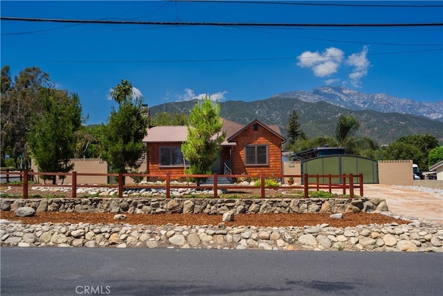 895 W 23rd St, Upland, CA 91784 - view of front of home with a mountain view and a fenced front yard