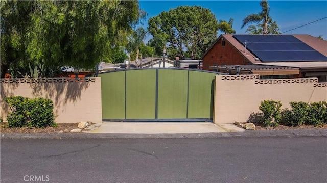 895 W 23rd St, Upland, CA 91784 - gate with fence and roof mounted solar panels